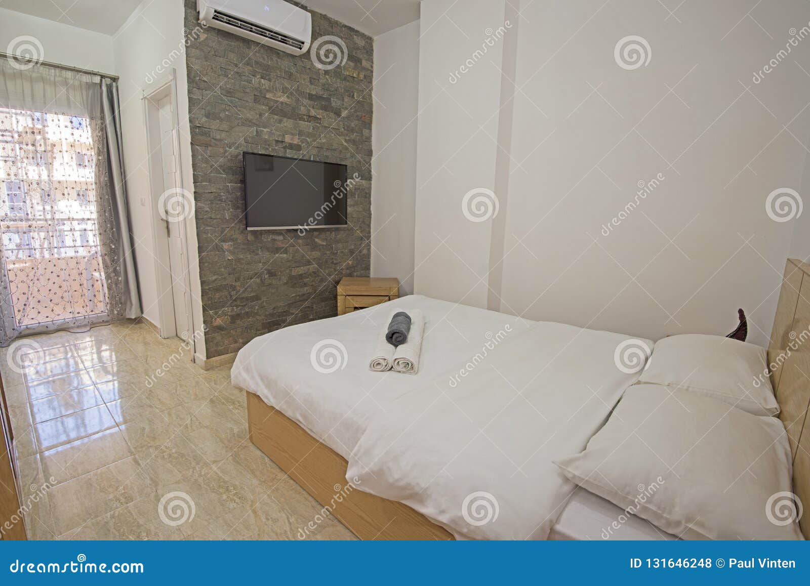 Interior design decor furnishing of luxury show home bedroom showing  furniture and double bed with futon style bed and mezzanine upper level  Stock Photo - Alamy