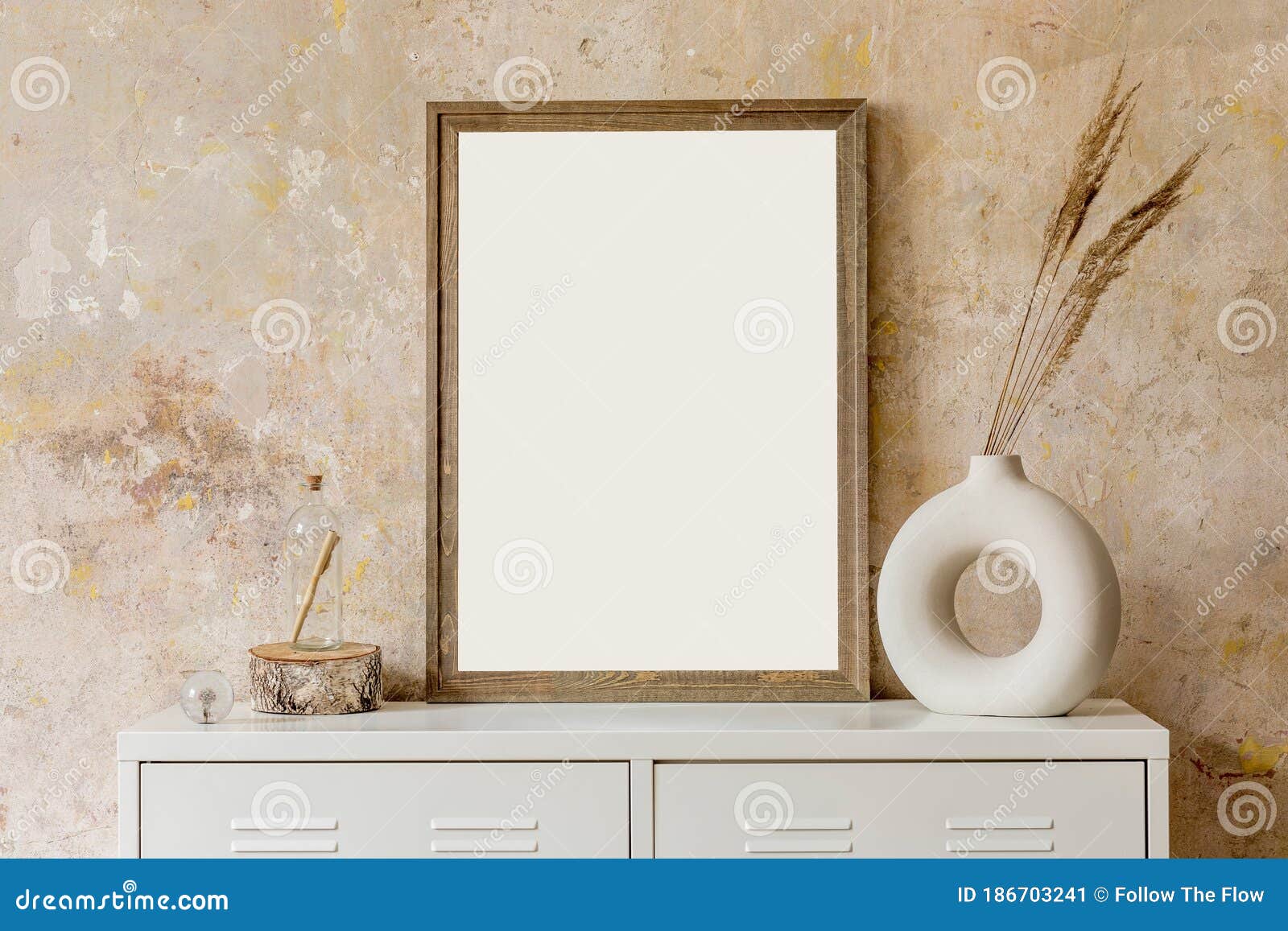 interior  of living room with wooden poster mock up frame and elegant personal accessoreis. grunge wabi sabi wall.