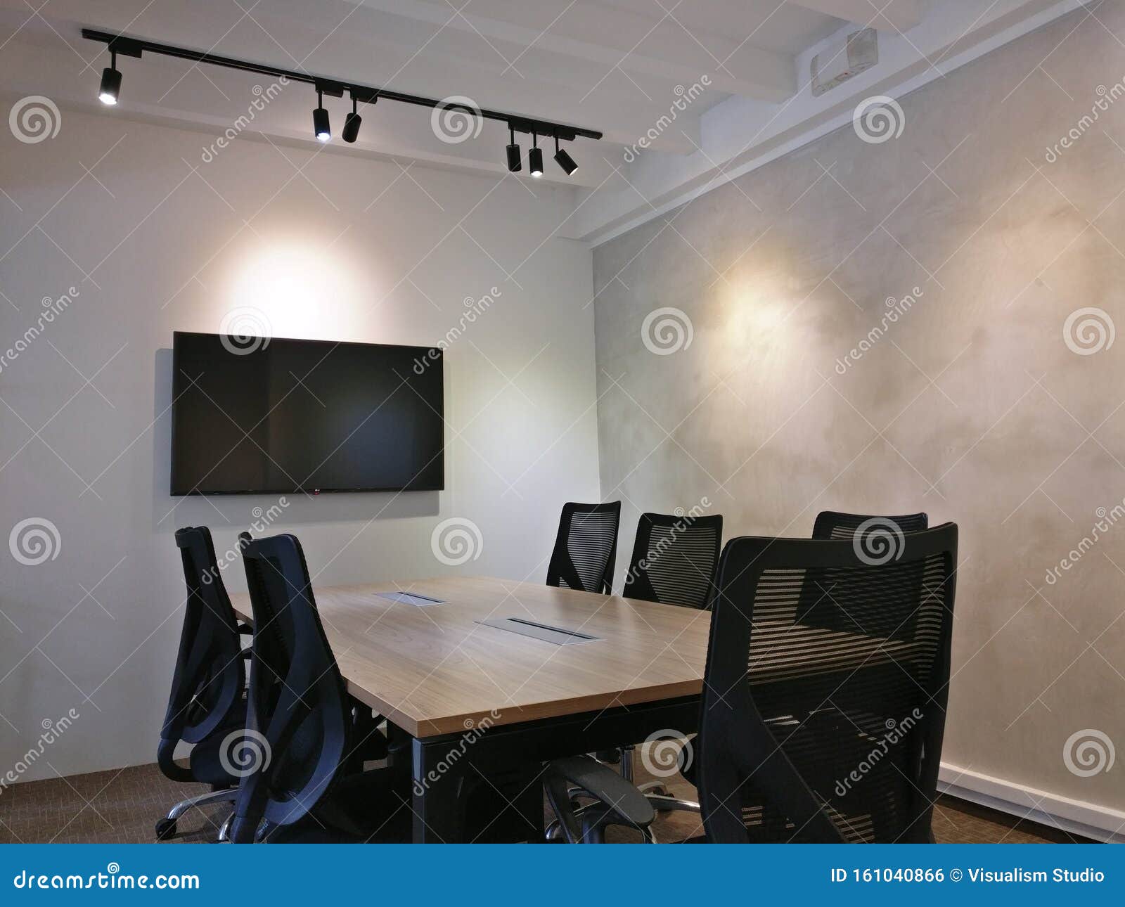 interior  of meeting rooms with black chairs and screens
