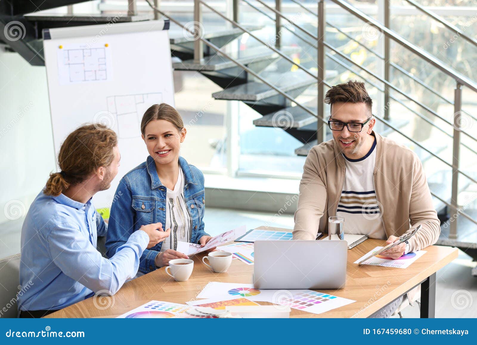 Interior Designer Consulting Young Couple Stock Photo