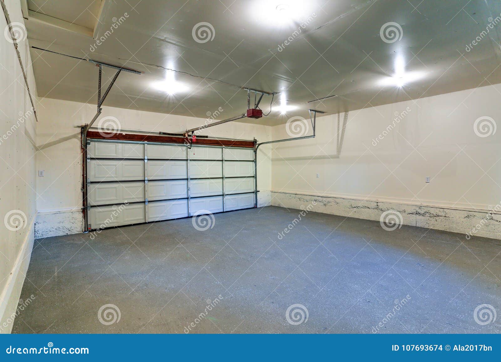 Interior of an Empty Clean Garage with Closed Door Stock Photo Image