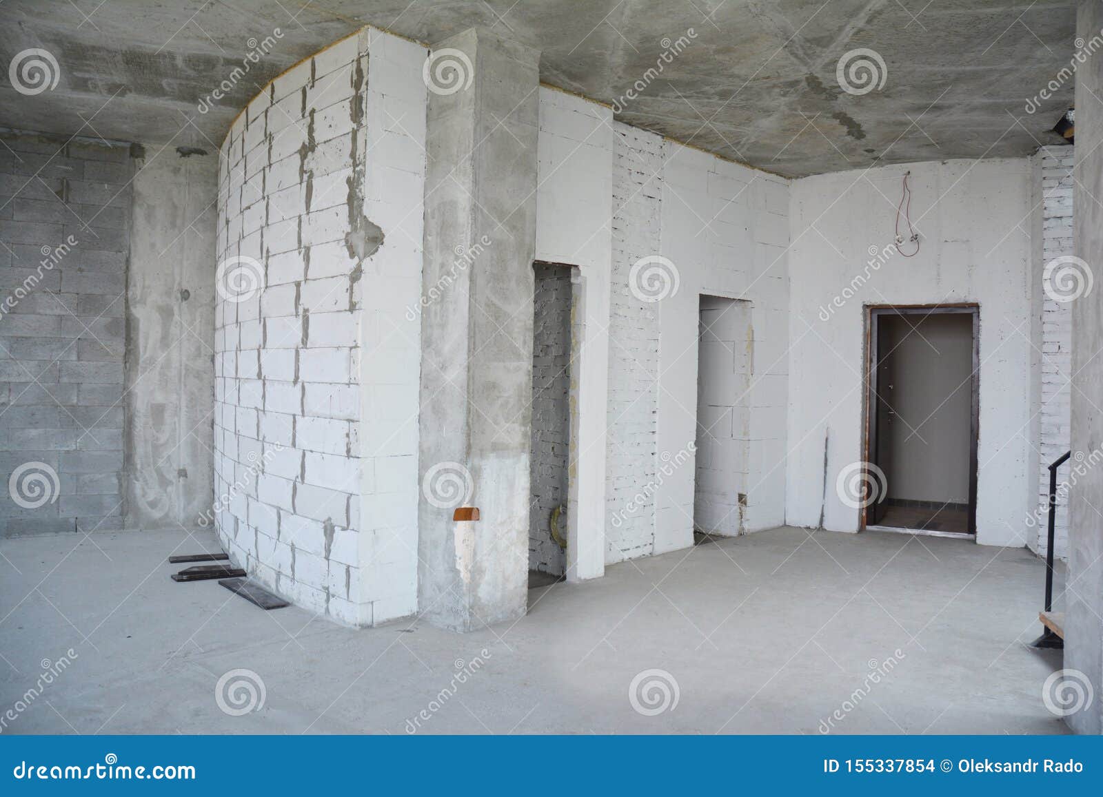 interior hall room under construction, metal door lintels. wall without plasterwork and ready to remodel