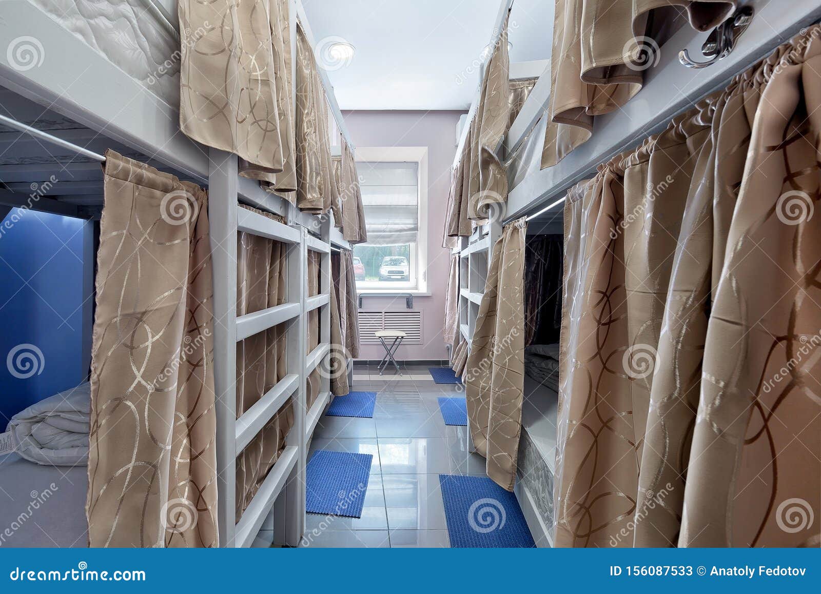 Interior Of The Hostel Room Bunk Beds With Fabric Blinds