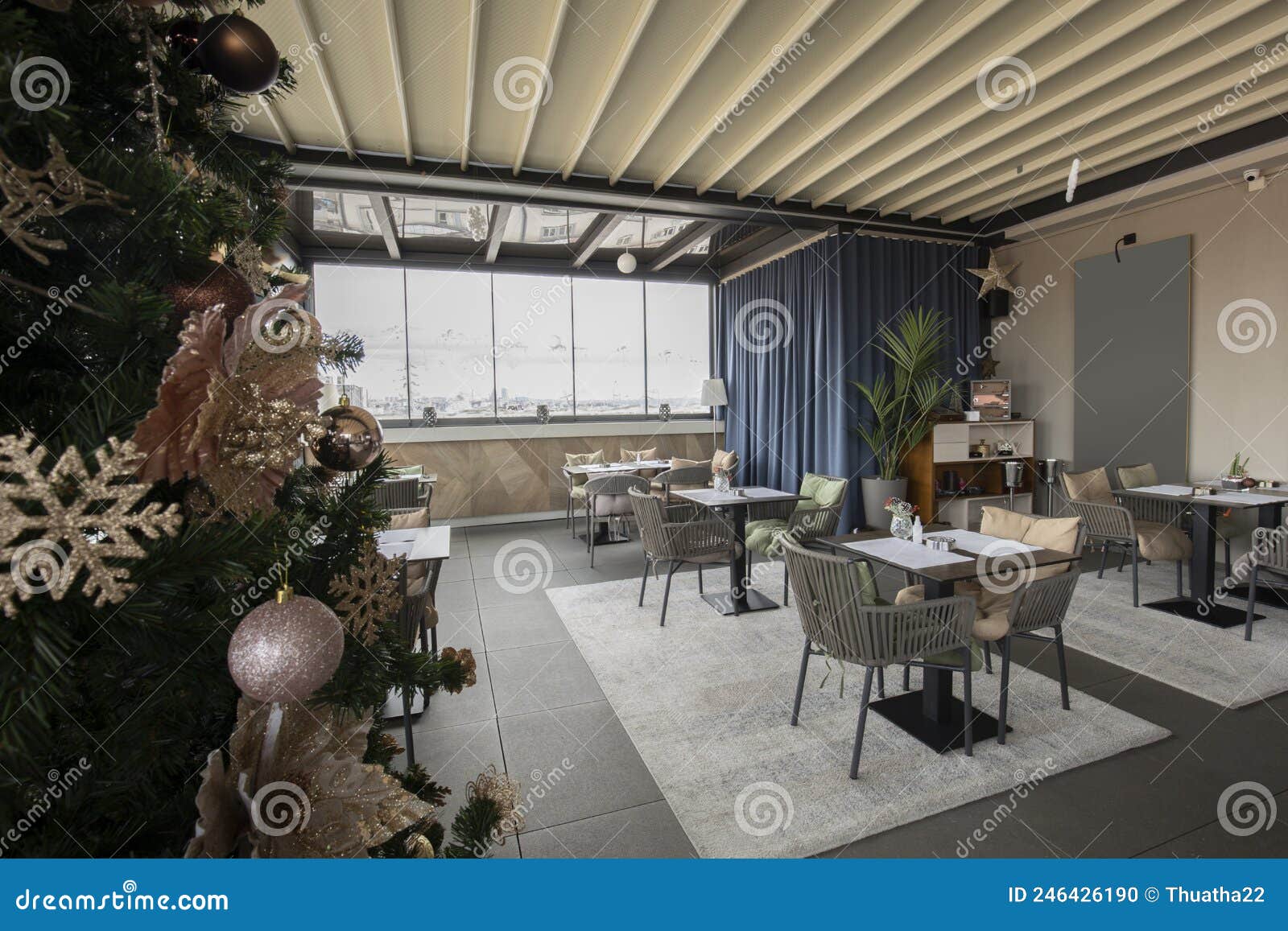 Interior of a Hotel Restaurant with Decorated Christmas Tree Editorial
