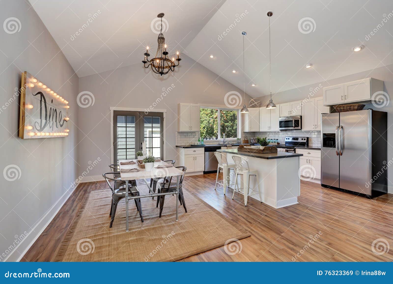 Interior Of Kitchen And Dining Room With High Vaulted Ceiling