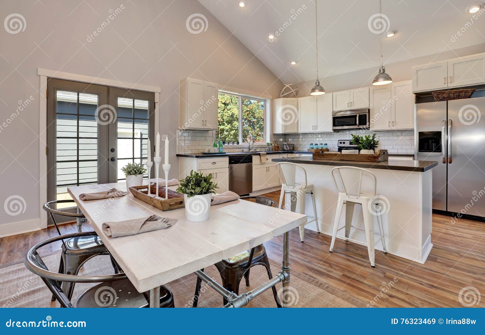 Interior Of Kitchen And Dining Room With High Vaulted Ceiling