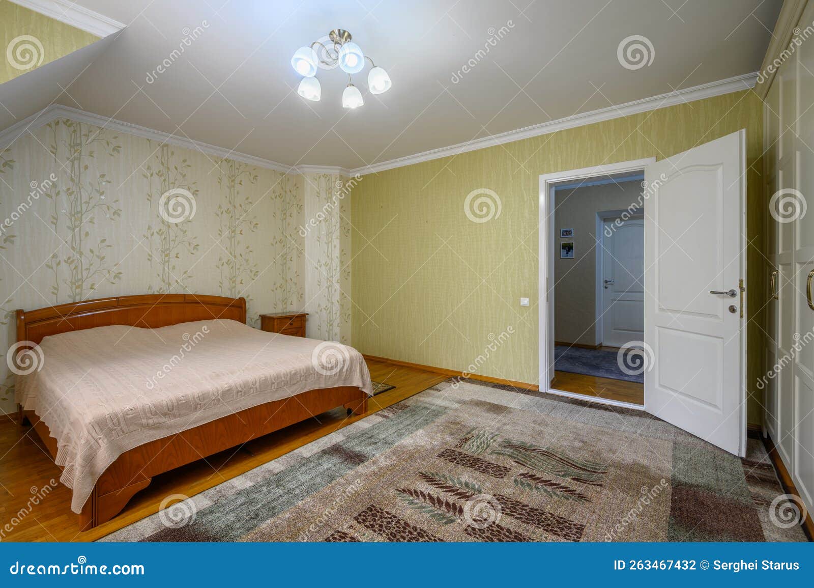 Interior of a Large Comfortable Bedroom with Double Bed Stock Photo