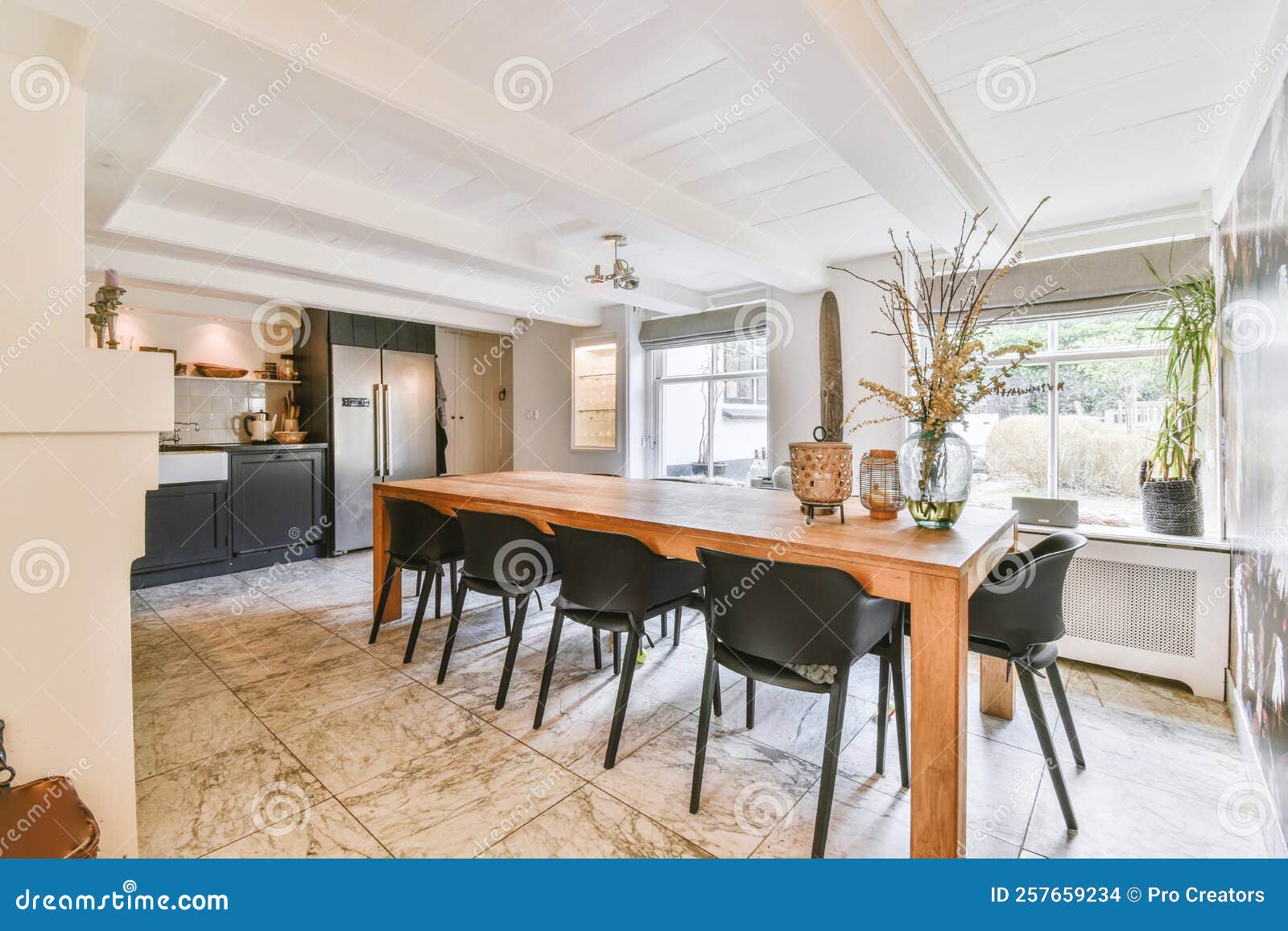 Kitchen and Dining Room in Modern Apartment Stock Photo - Image of