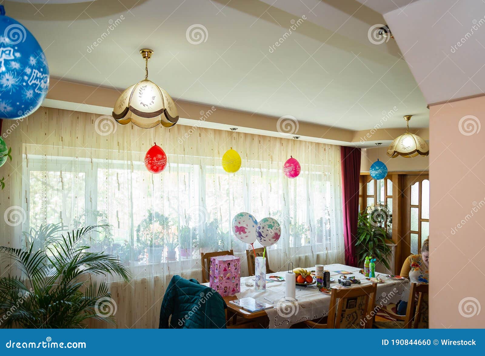 Interior of a Living Room with Balloons Hanging from the Ceiling ...