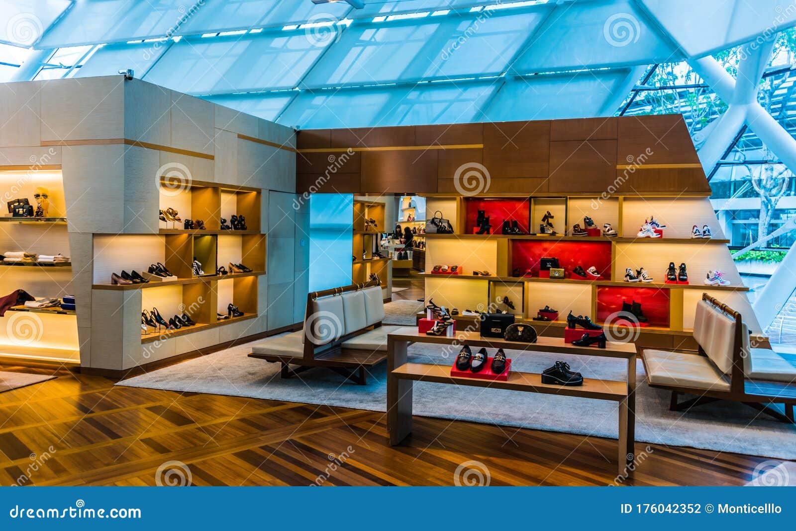 Luxury designer handbags on display in a Singapore shopping mall