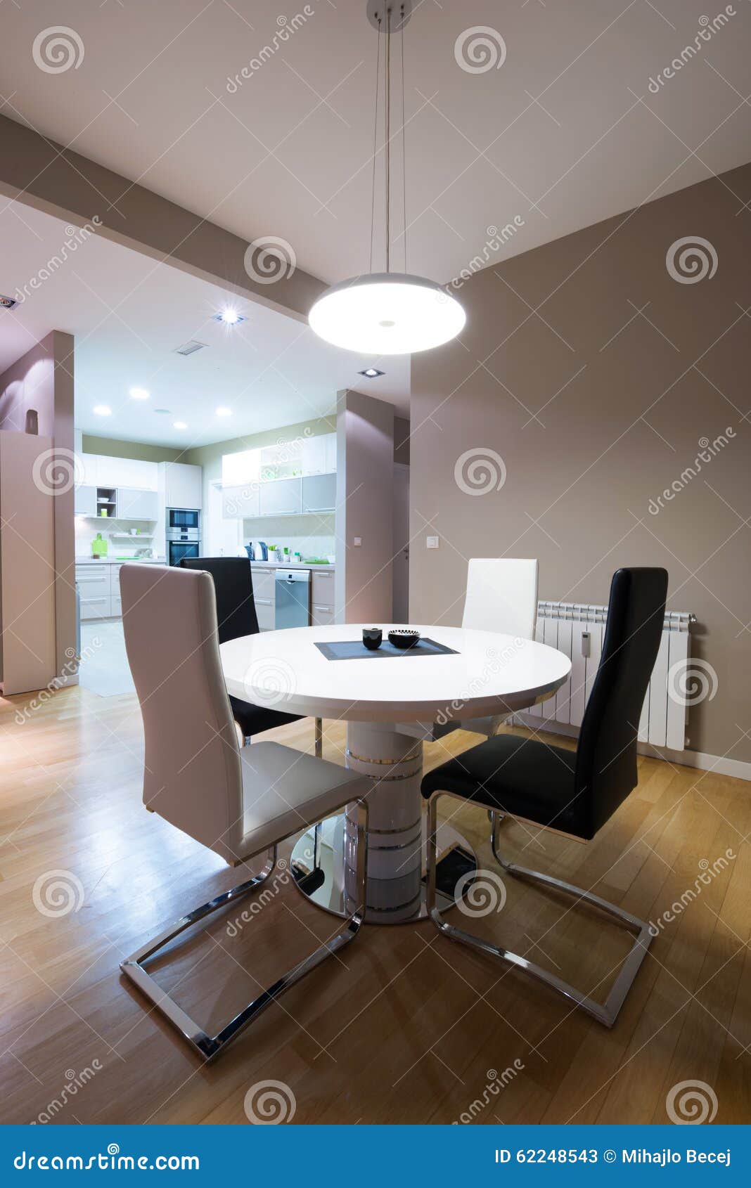 Interior of a Luxury Dining Room with Round Table and a View To Stock