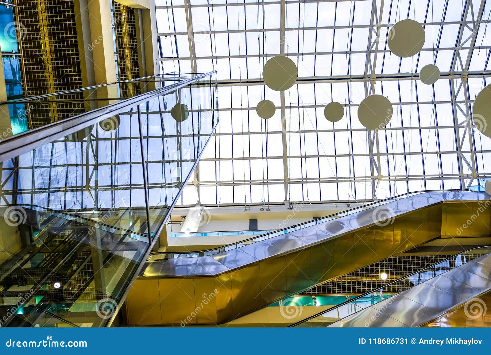 The Interior of a Modern Building with an Elevator. Glass Roof, Glass