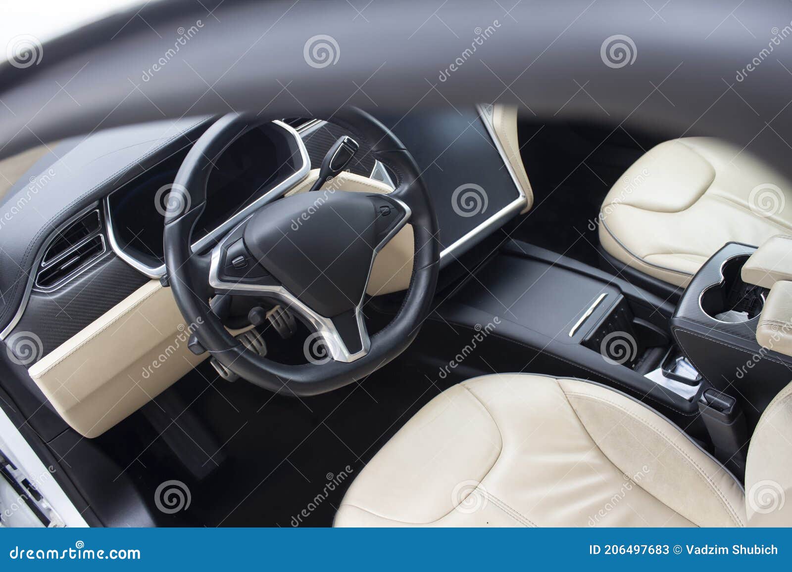 Interior of a Modern Car. Photo of a Car Interior with a Mockup of a Tablet with a Dark Screen