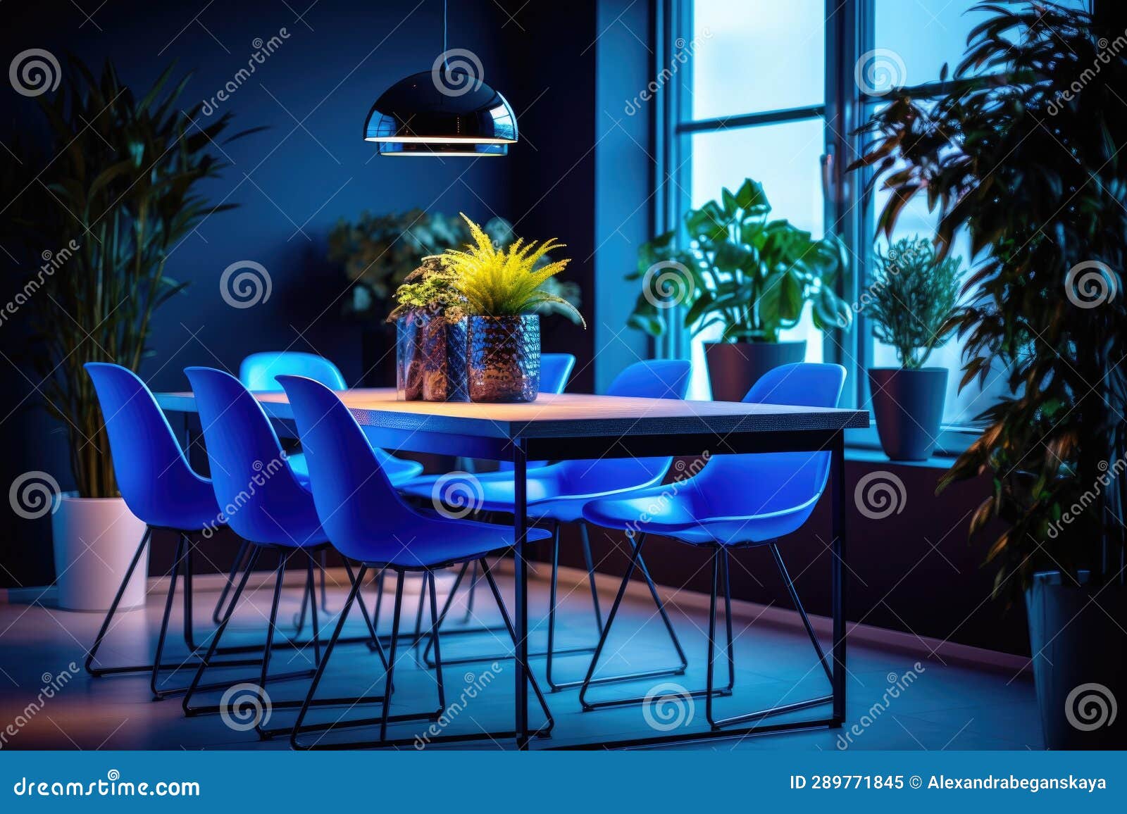 The Interior of a Modern Dining Room with a Dining Table and White Neon