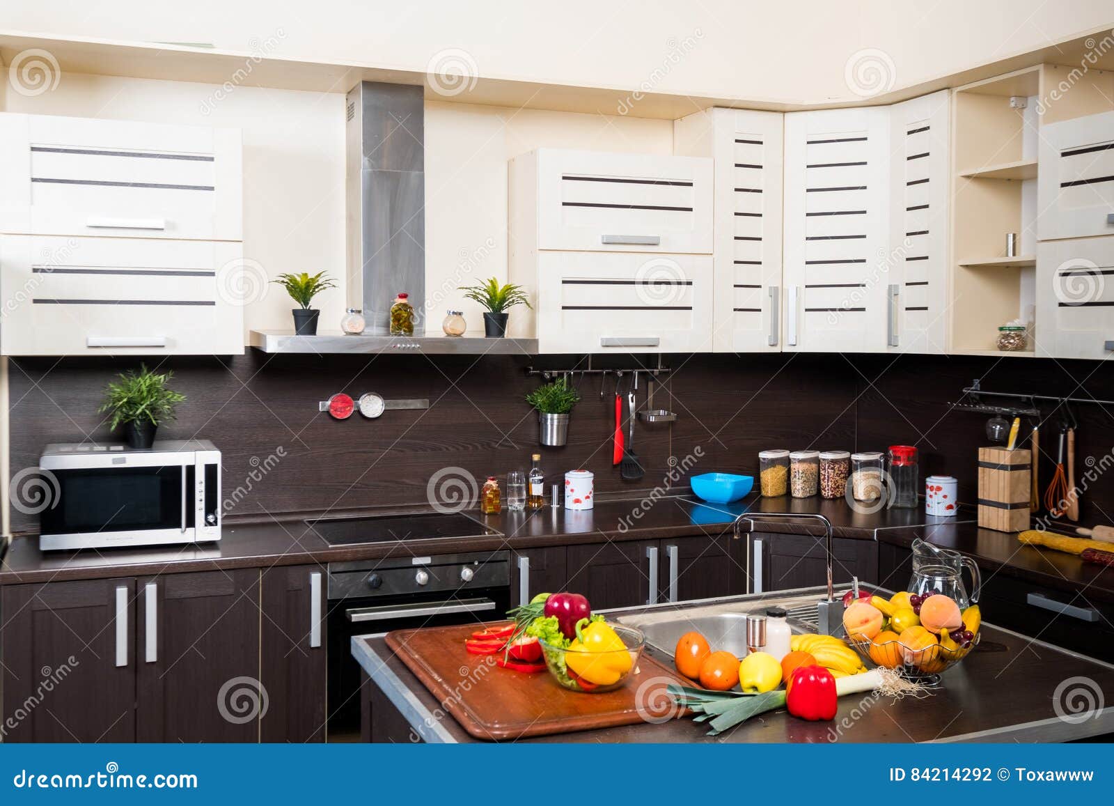 Interior of Modern Kitchen with Fruits and Vegetables Stock Photo