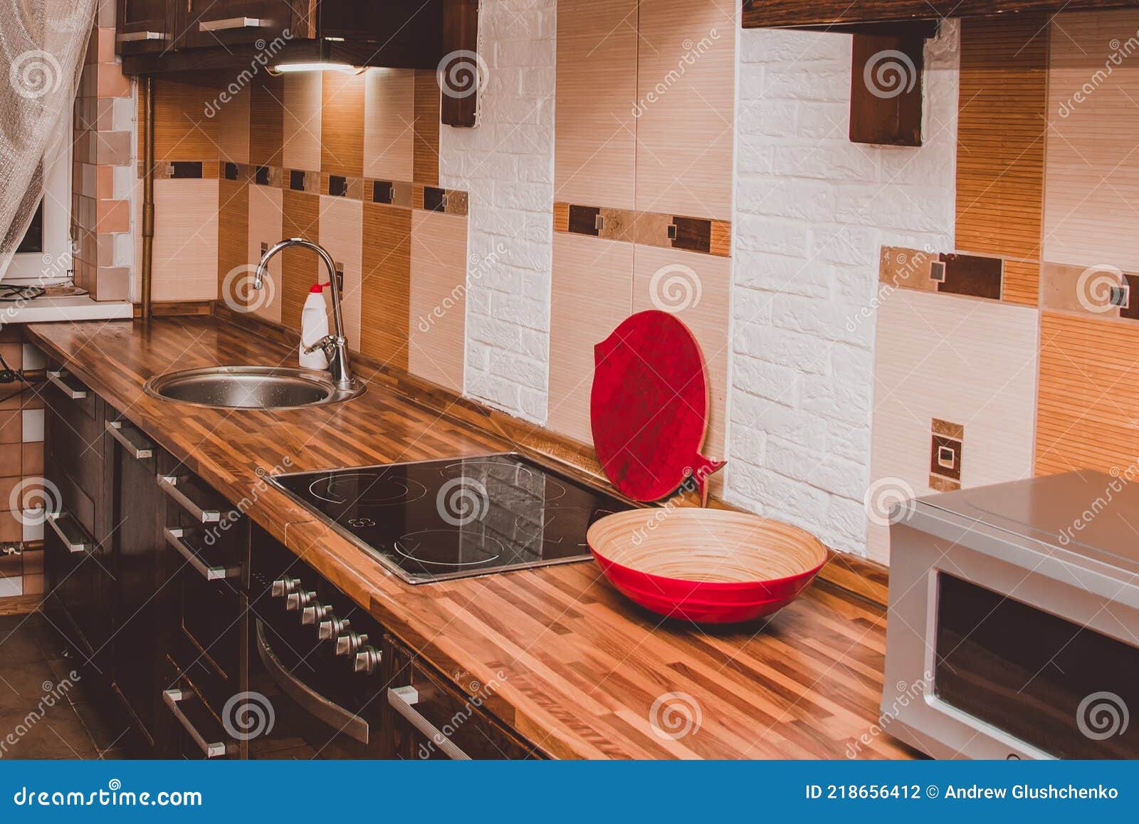 The Interior of a Modern Kitchen. Sink, Electric Stove in the Kitchen