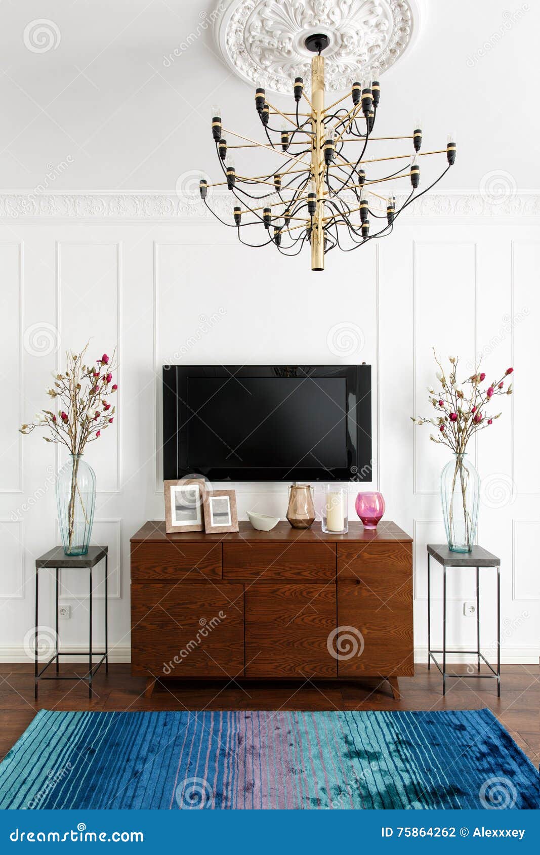 Interior Of A Room With White Walls A Tv And A Dresser In A Con