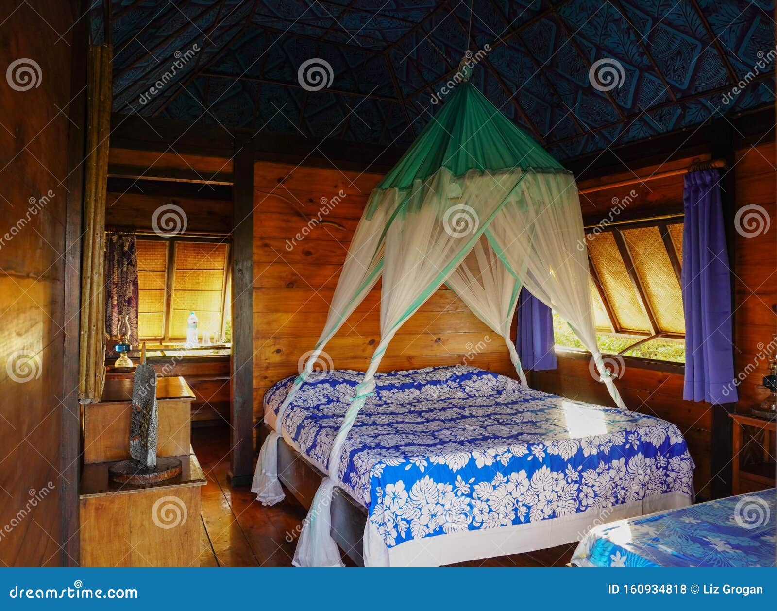 the interior of a rustic wooden bungalow on the tropical island of fakarava in french polynesia