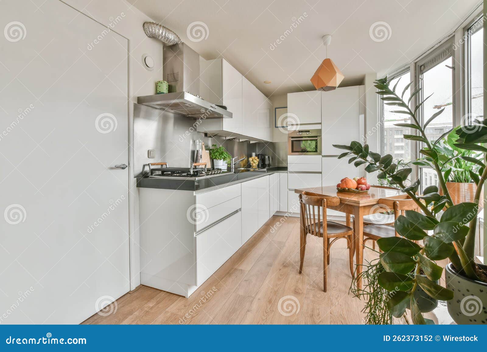 Interior Shot of a Dining Table Next To a Kitchen in a Nice House Stock Photo Image of dining