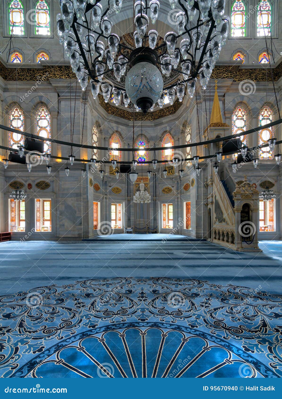 interior shot of nuruosmaniye mosque overlooking niche mihrab and marble minbar platform facade, istanbul, turkey