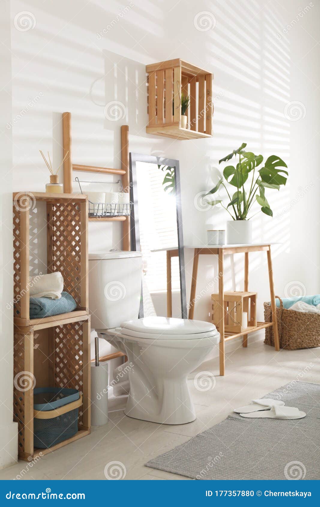 Interior of Bathroom with Toilet Bowl and Decor Elements Stock Photo