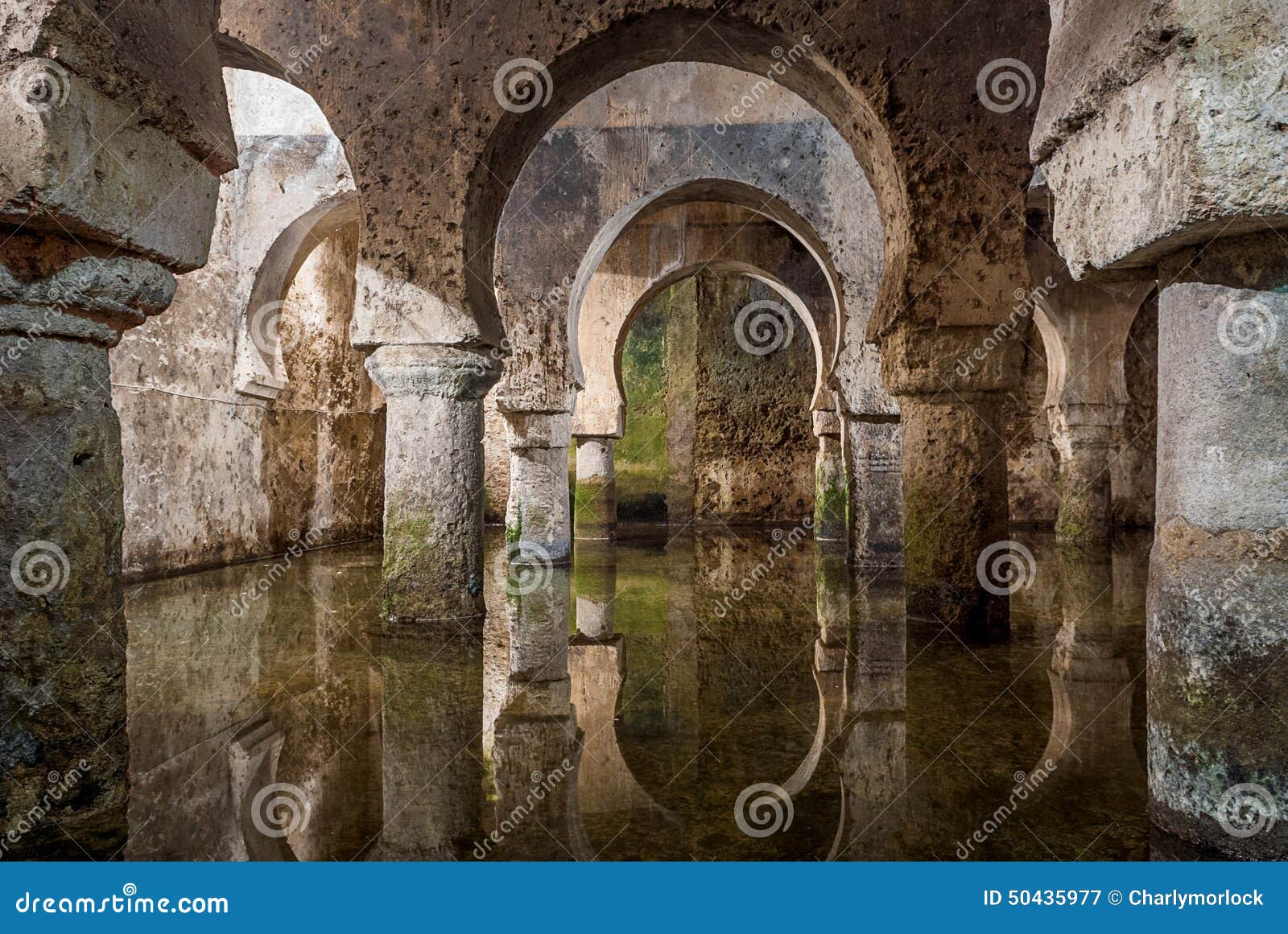 interior view of the arab cistern caceres spain, reflections of the arches in the water