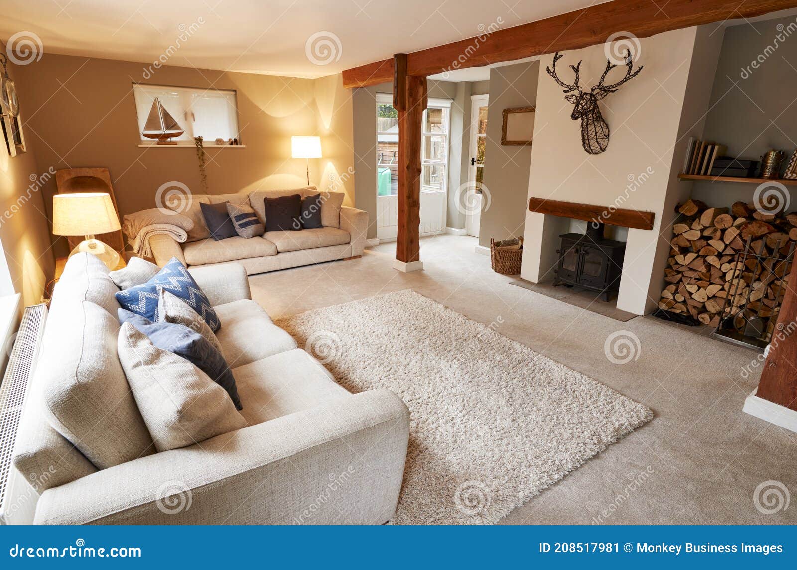 Interior View of Beautiful Lounge with Sofas and Log Burner in Family
