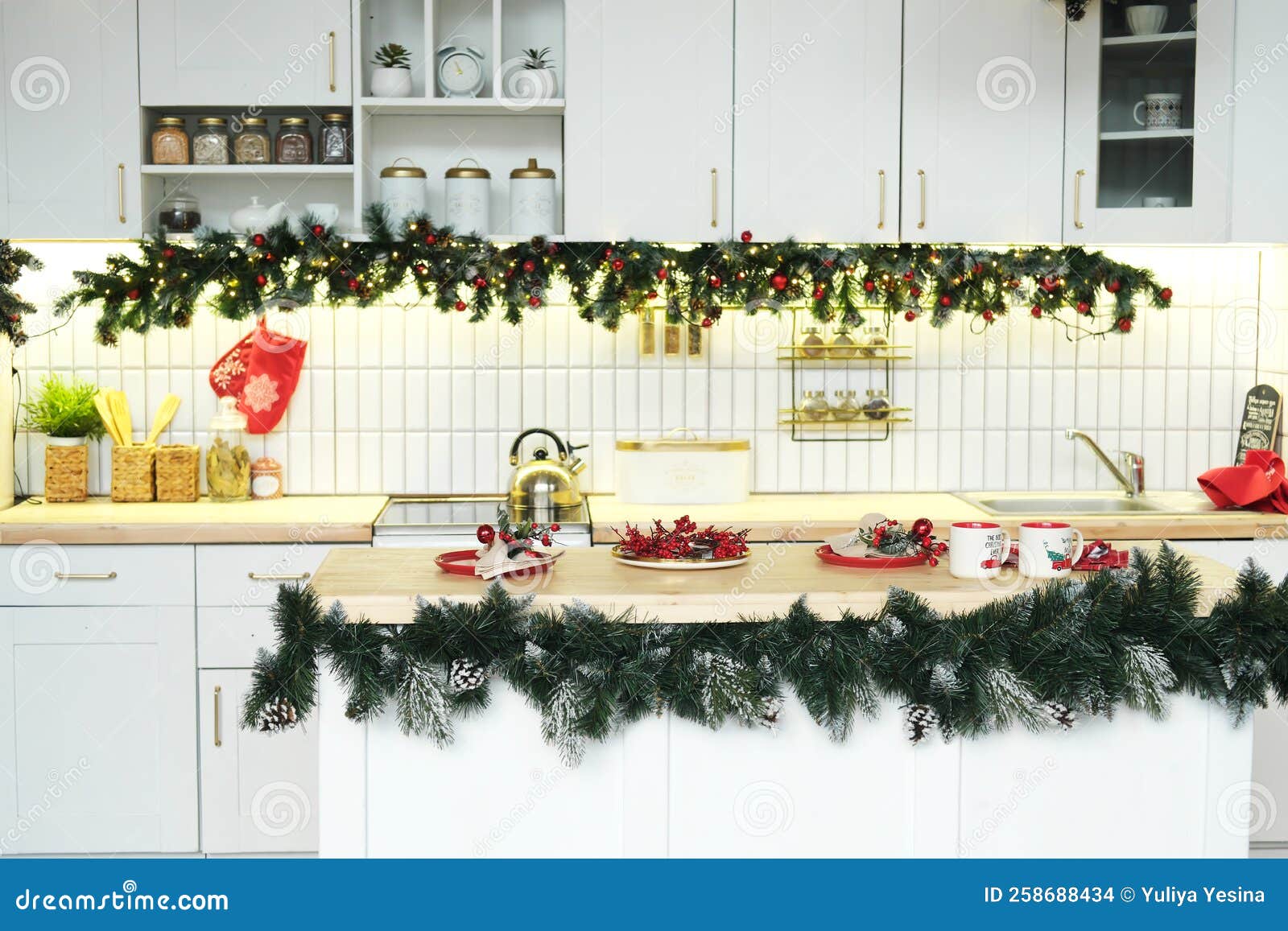 Interior White Kitchen with Christmas Decor and Decorated Fir Tree