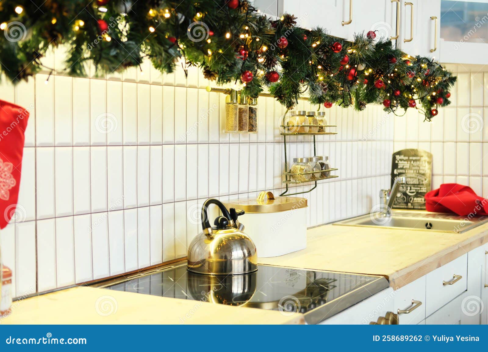 Interior White Kitchen with Christmas Decor and Decorated Fir Tree