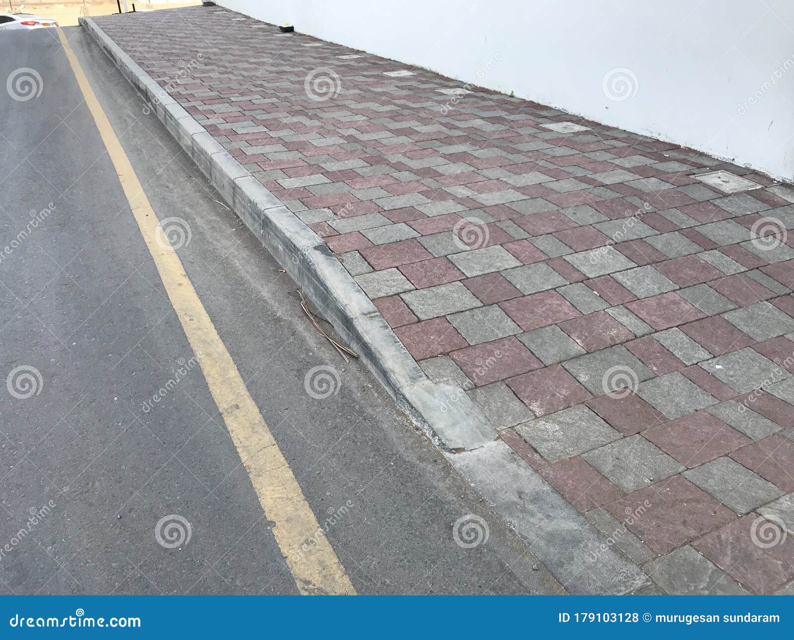 Interlock Tile Flooring and Protected by Kerb Precast Concrete Stones