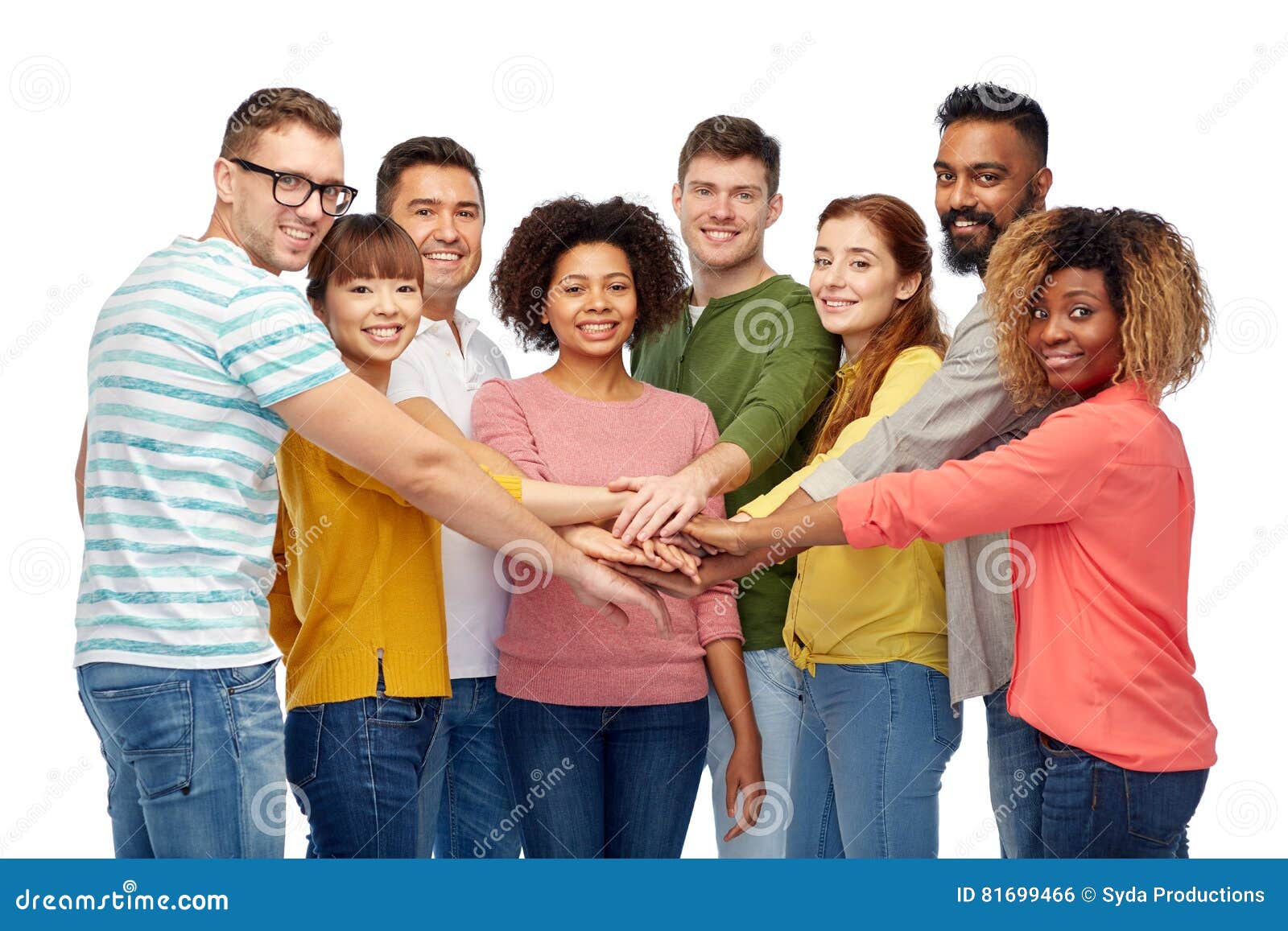 international group of happy people holding hands