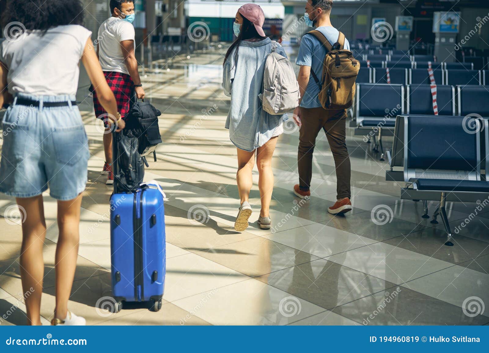 International Group Of People Walking On The Hall Of Airport Stock