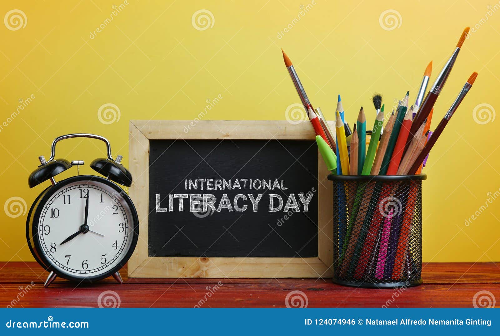 international literacy day. alarm clock, blackboard and school s