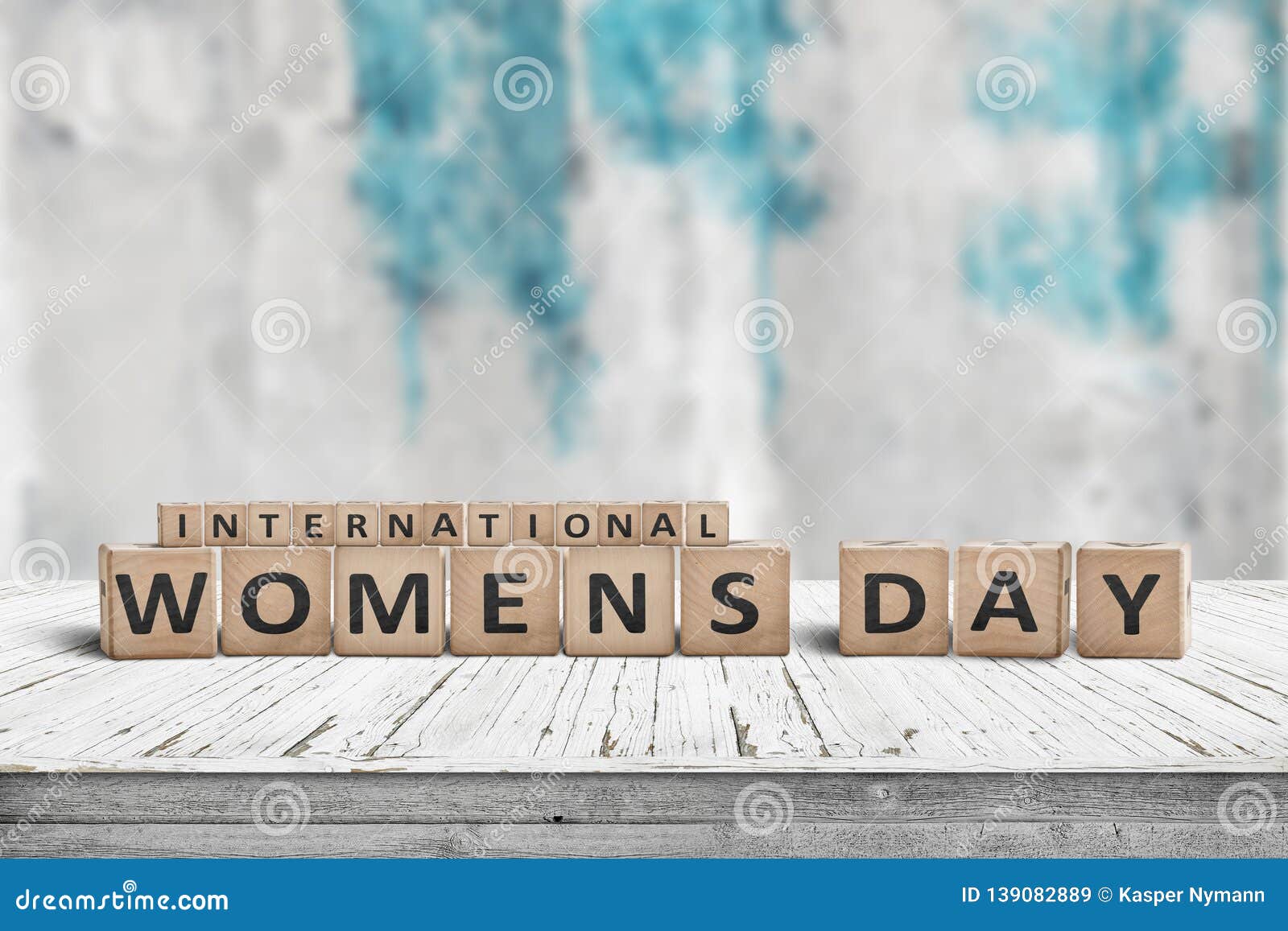 international womens day sign on a wooden table