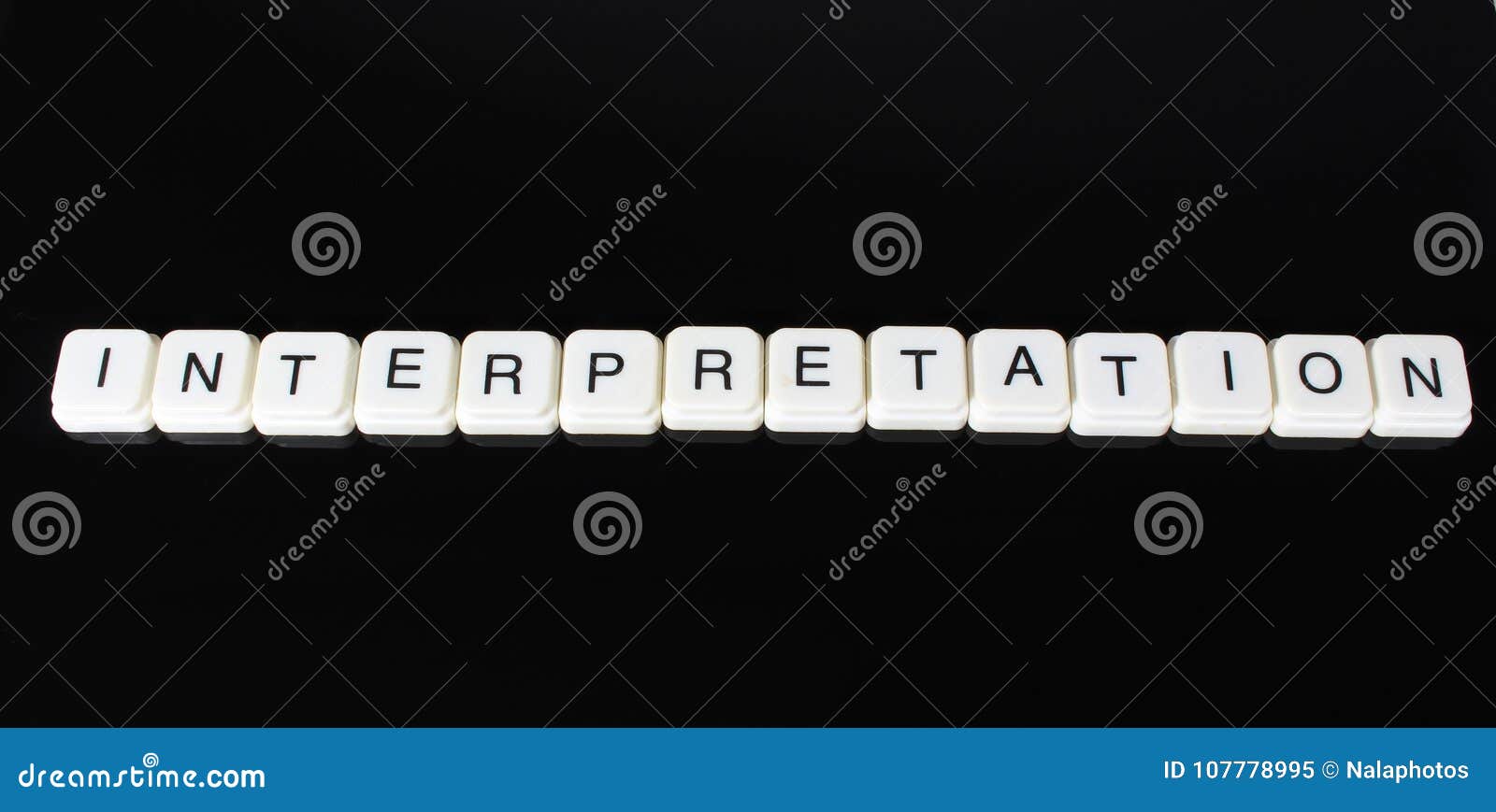 interpretation text word title caption label cover backdrop background. alphabet letter toy blocks on black reflective background.