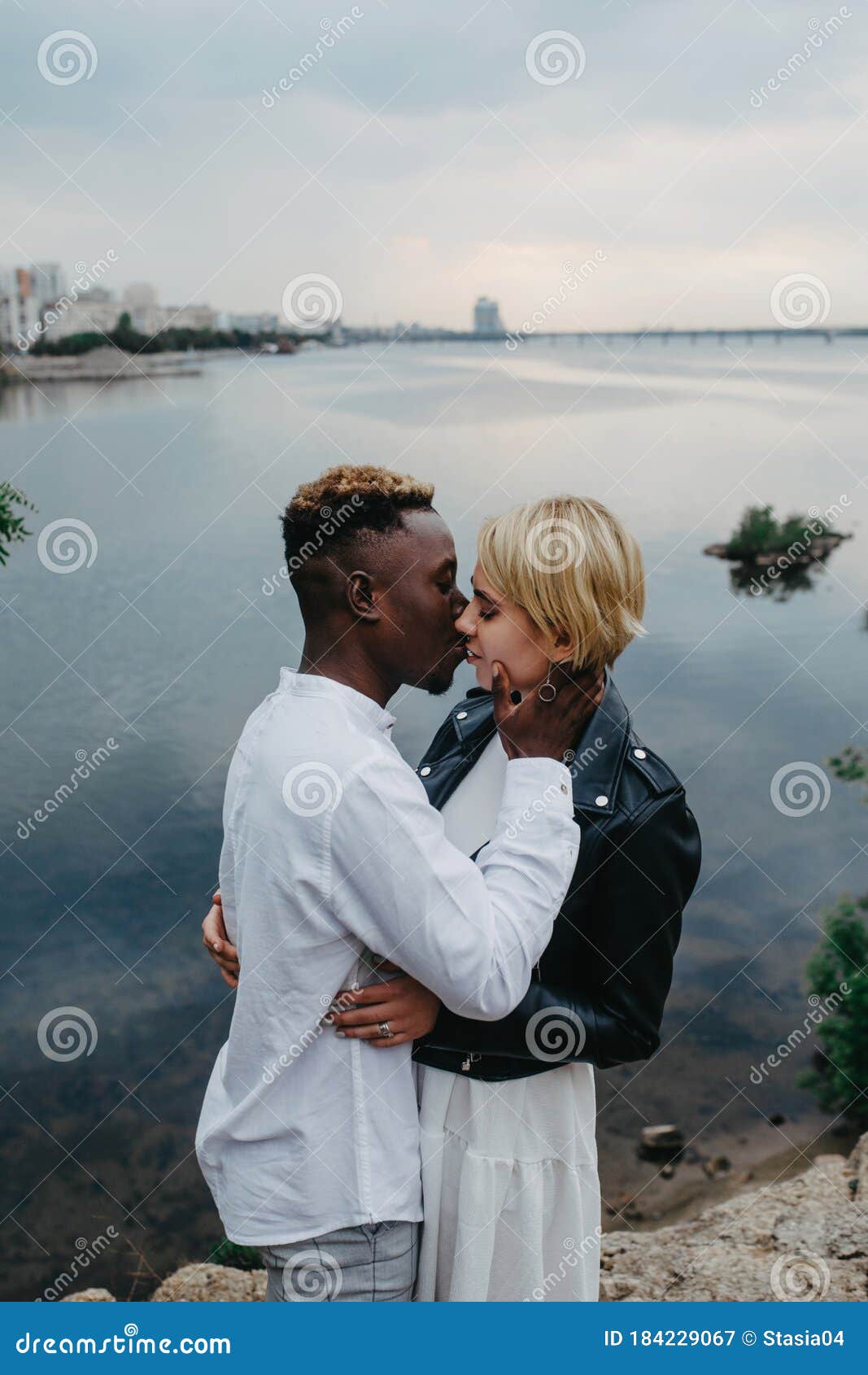 Interracial Couple Kisses And Hug