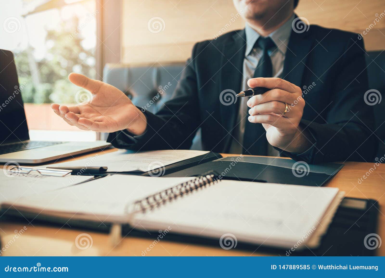 interviewer is sitting to explain about the work of the new employee