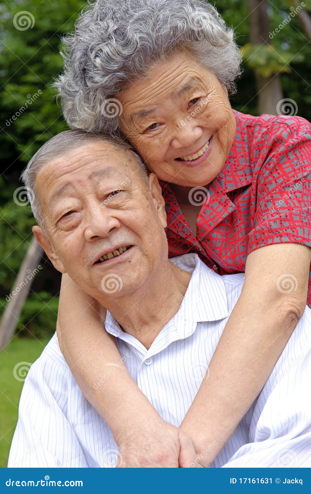 an intimate senior couple embraced