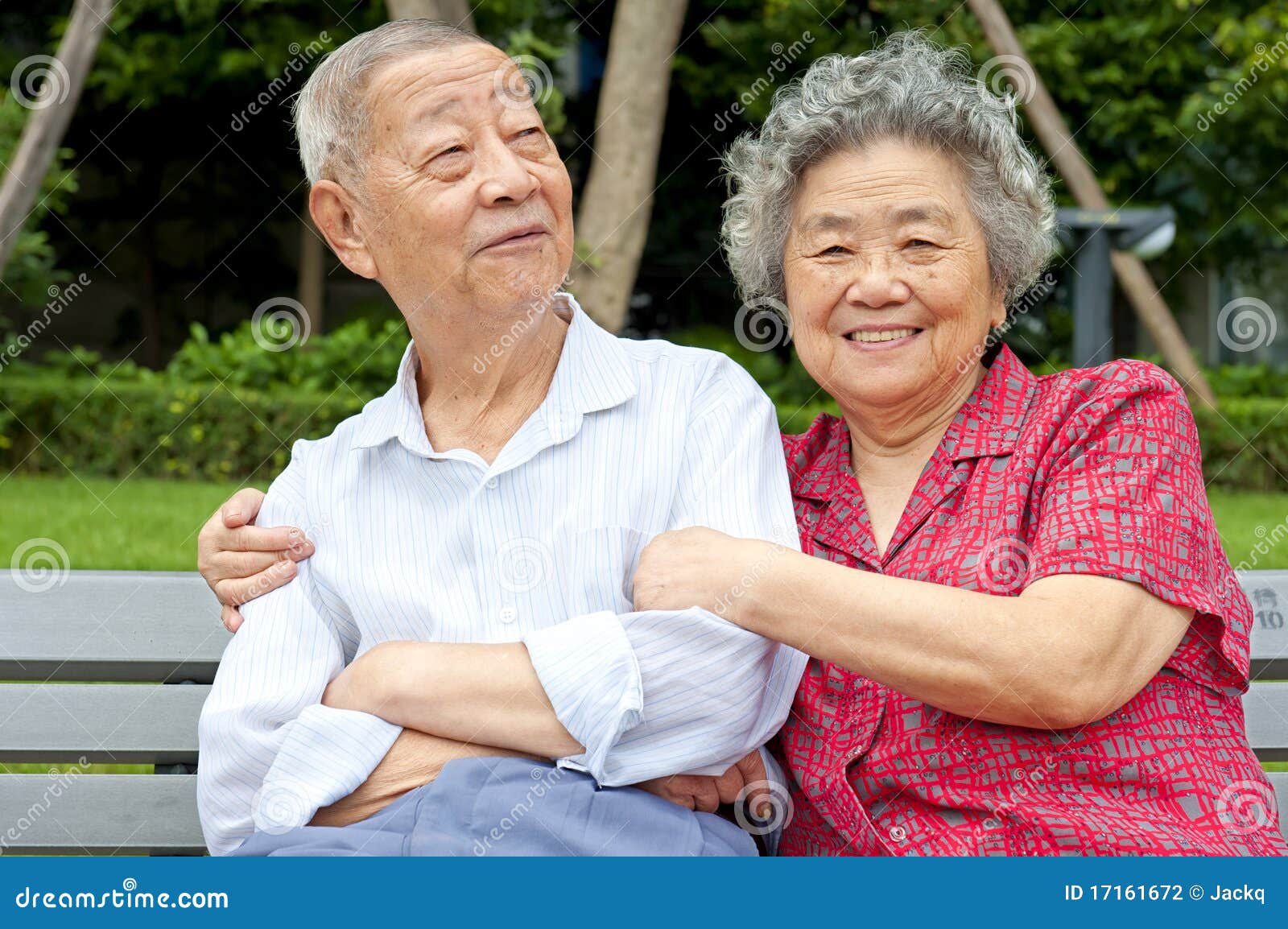 an intimate senior couple embraced