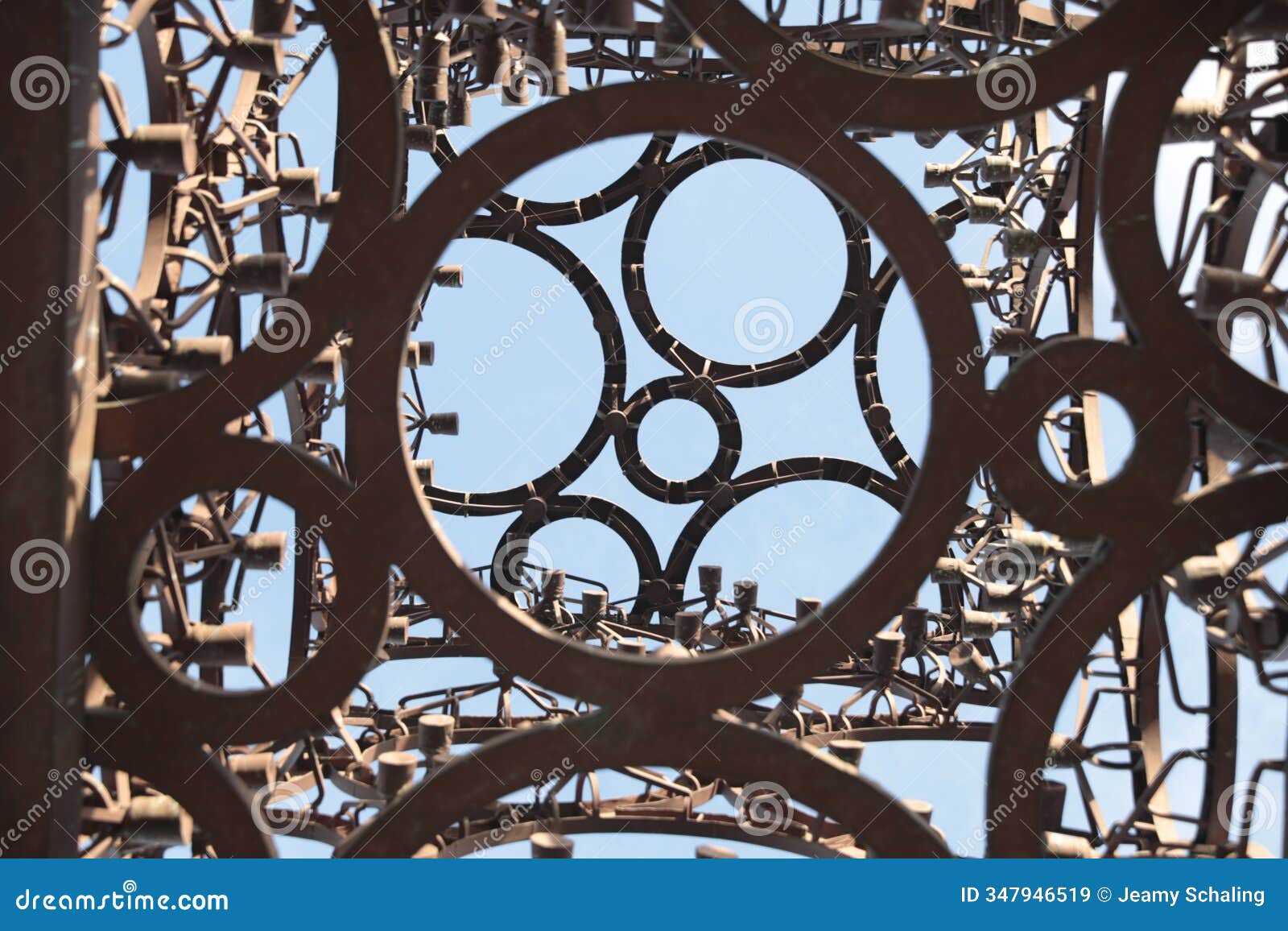 intricate metalwork  against a clear blue sky