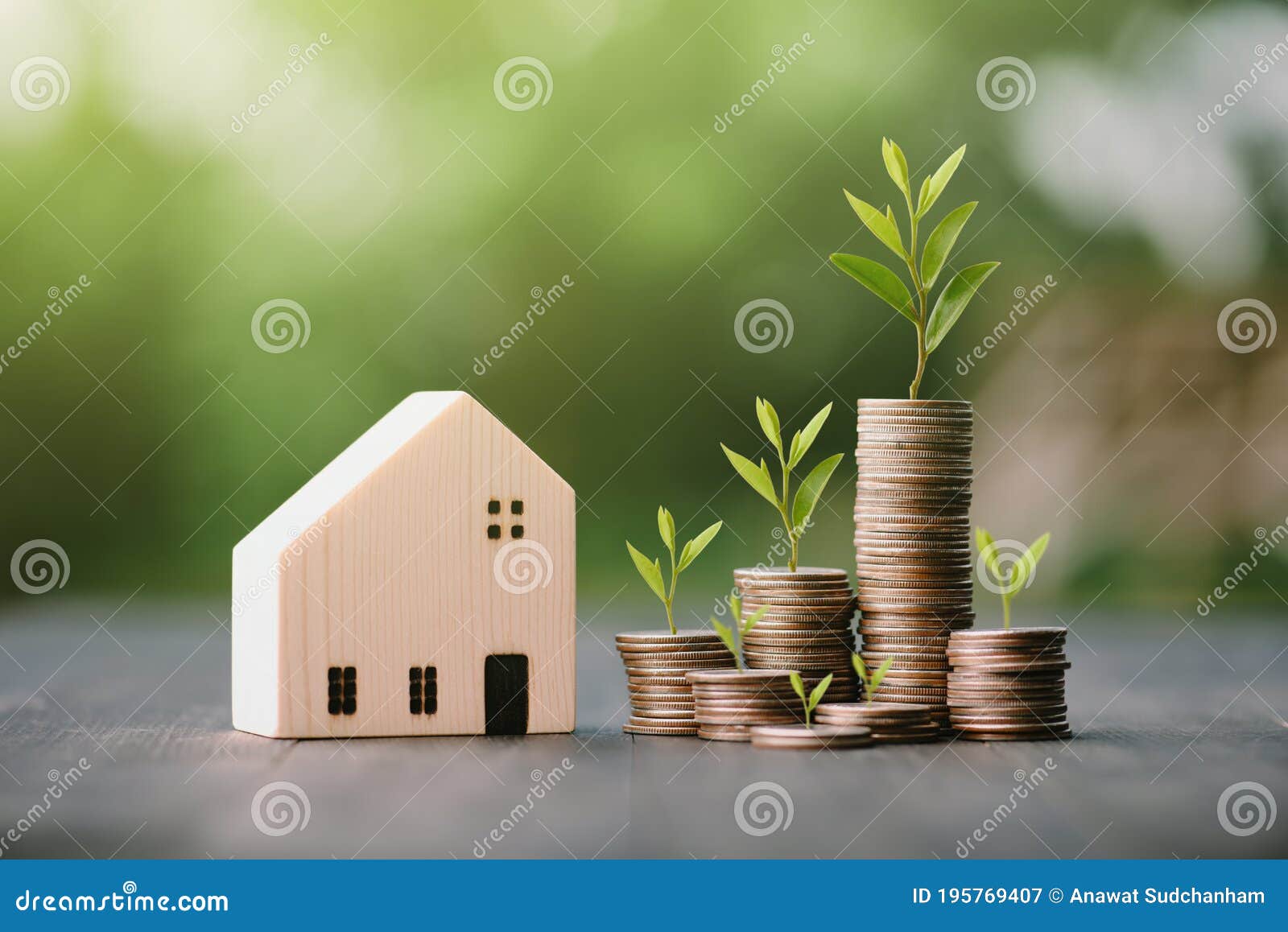 investment in the real estate business. money coin stack growing graph and wood house model. loans for the purchase of residential