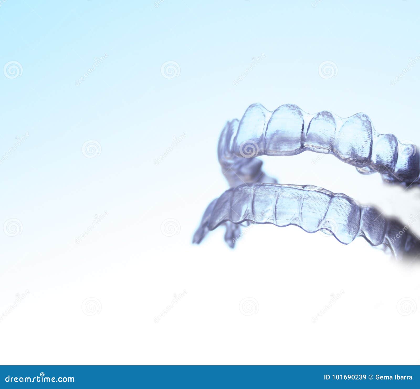 invisible dental orthodontics held by a woman