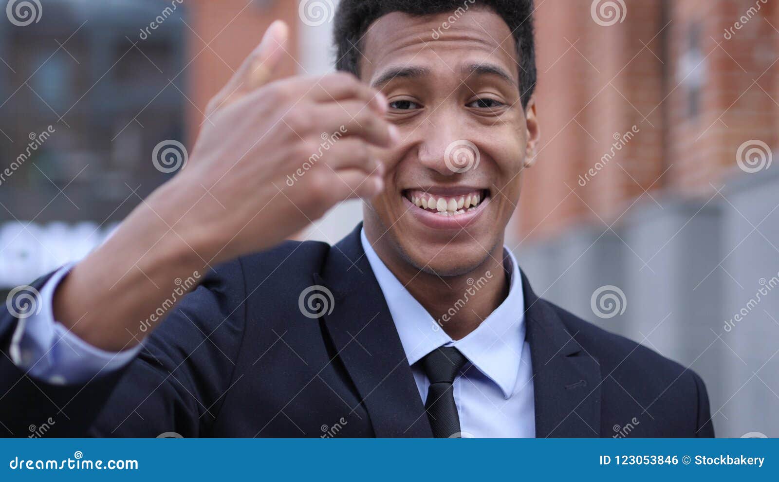 Inviting Gesture by Young African Businessman Stock Photo - Image of ...