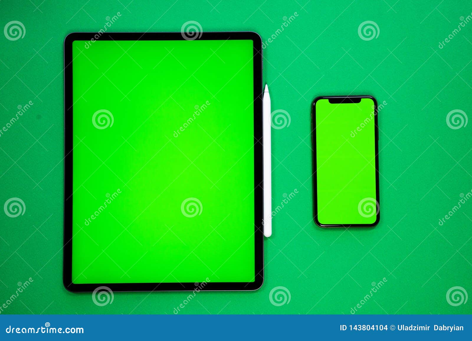 IPad and IPhone, New Tablet on a Green Background with a Pen, and Green  Screen Top View Stock Photo - Image of light, denim: 143804104