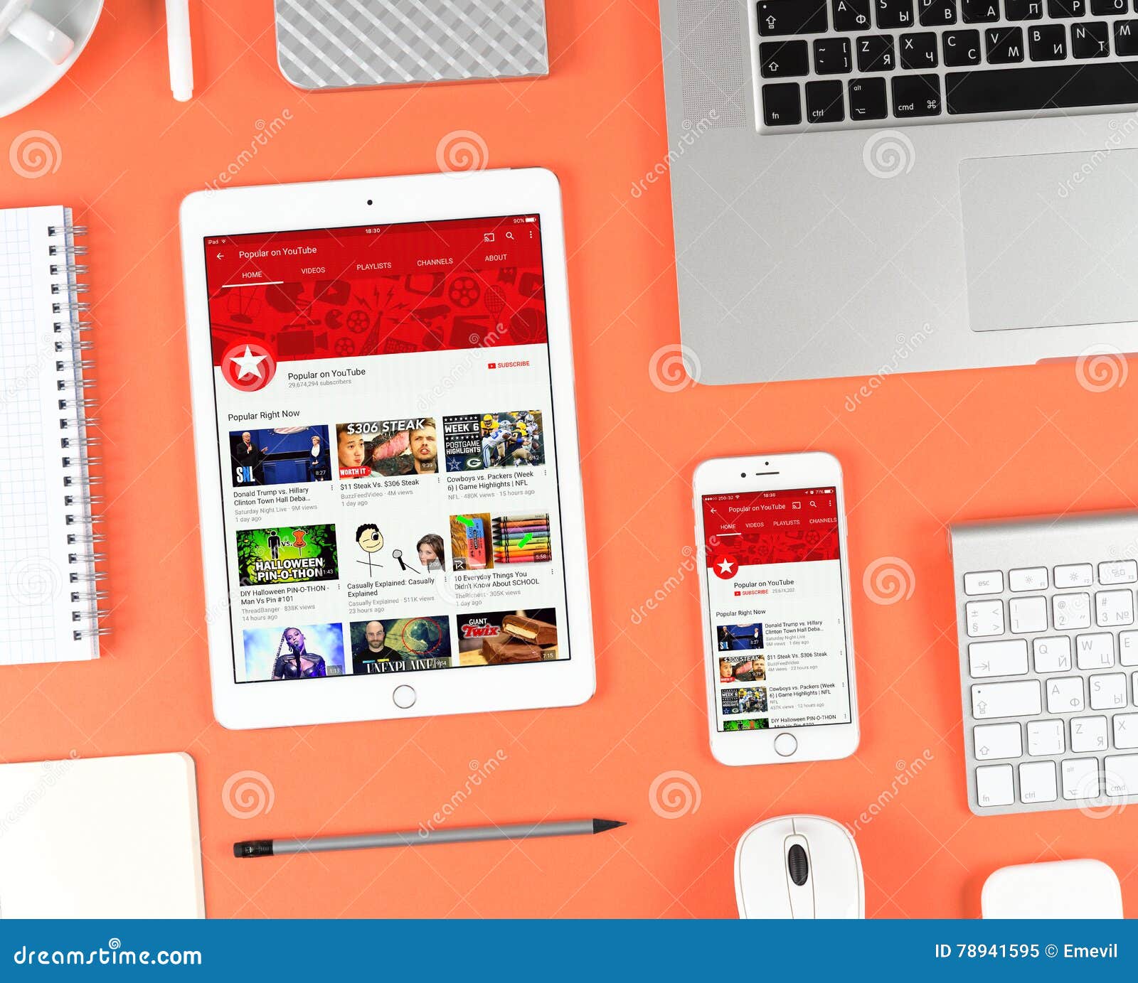Iphone和ipad在显示youtube App的红色背景编辑类图片 图片包括有主页 设备