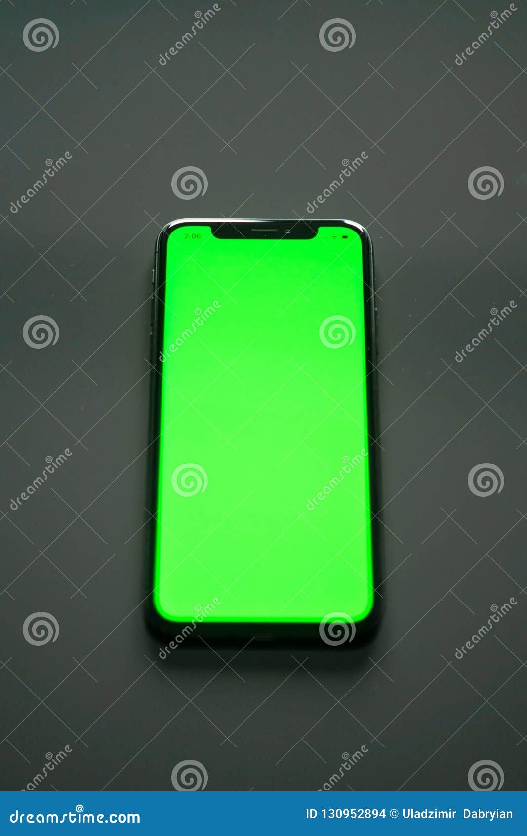 IPhone X, Green Screen on a Gray Background Stock Photo Image of