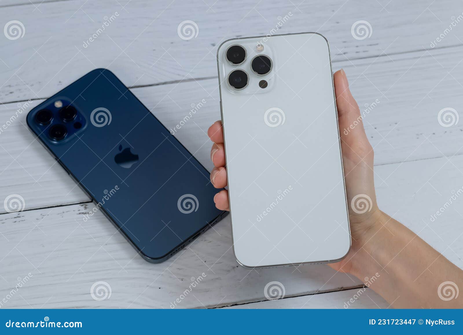 IPhone 13 Pro Max in Silver and IPhone 12 Pro Max in Pacific Blue. Editorial Photography Image