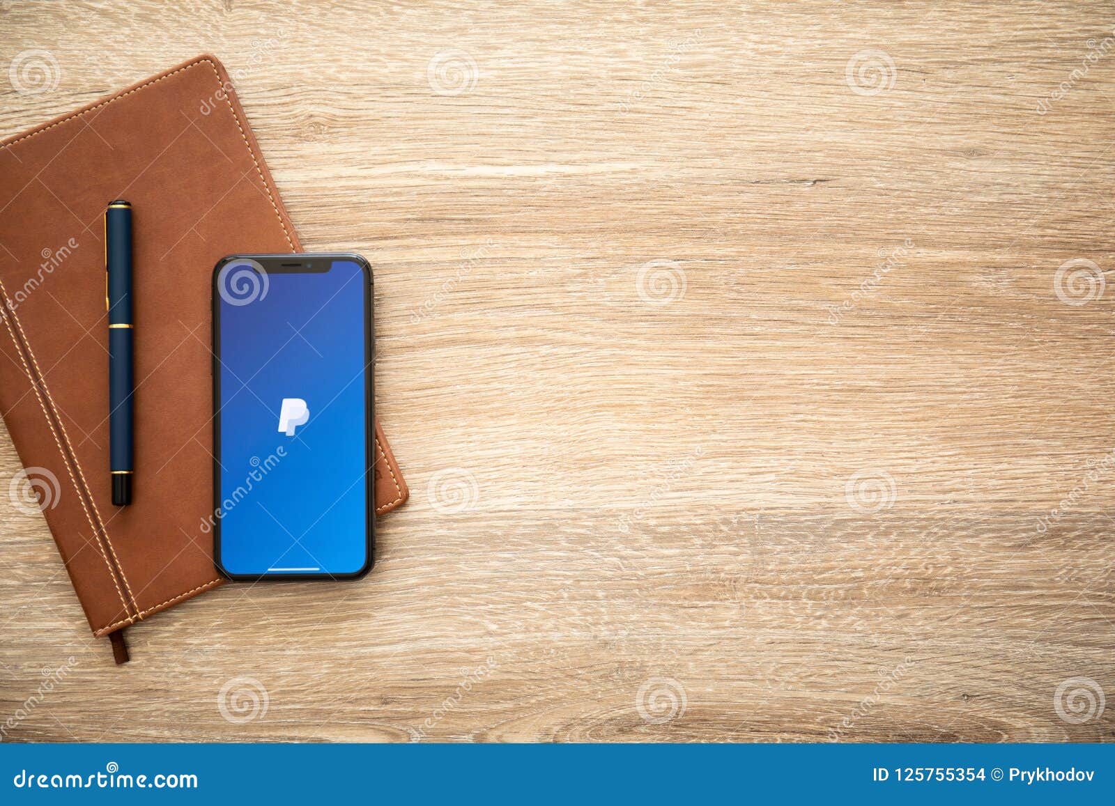 Iphone X With Service Paypal And Background Wooden Desk Editorial