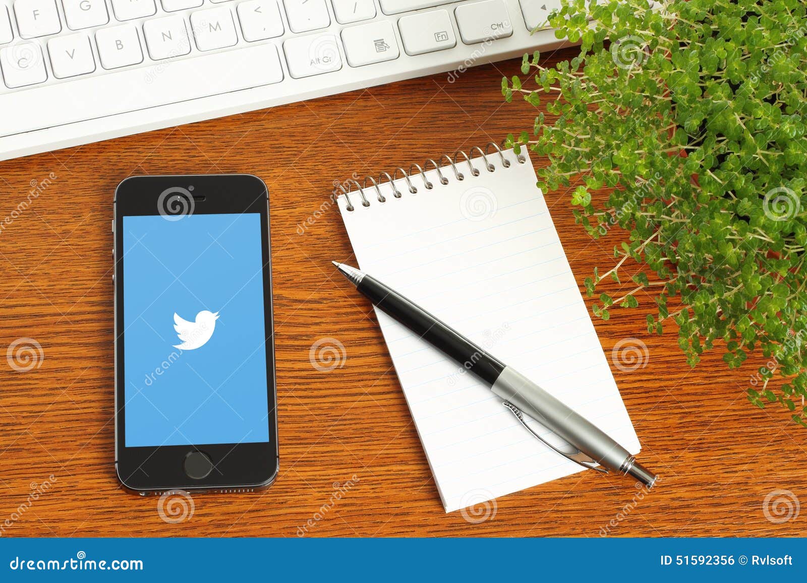 IPhone with Twitter Logotype on Wooden Background Editorial Photo
