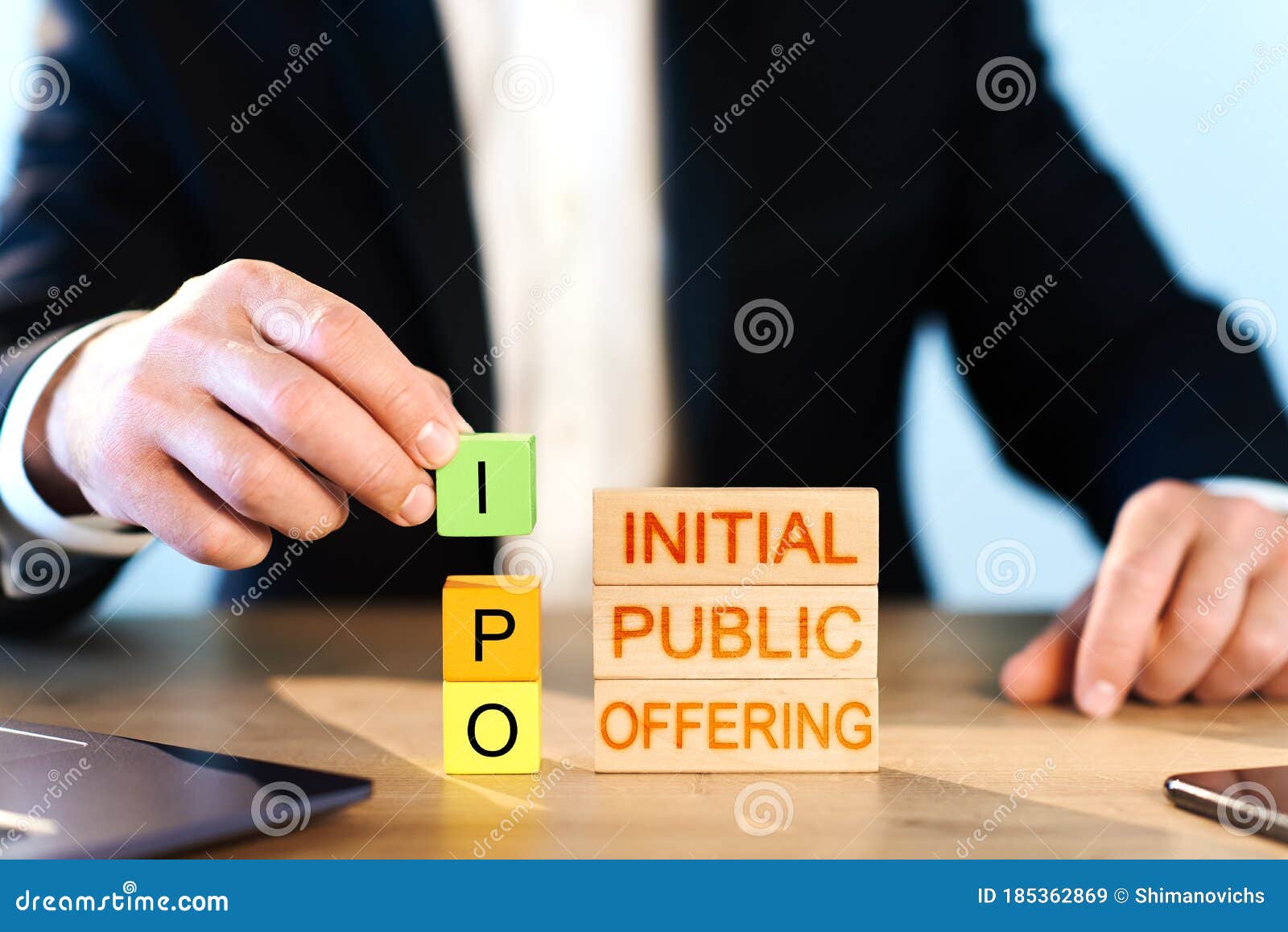 Ipo Concept. a Man Stacks Wooden Blocks with the Words Initial, Public,  Offering. Stock Image - Image of investing, exchange: 185362869